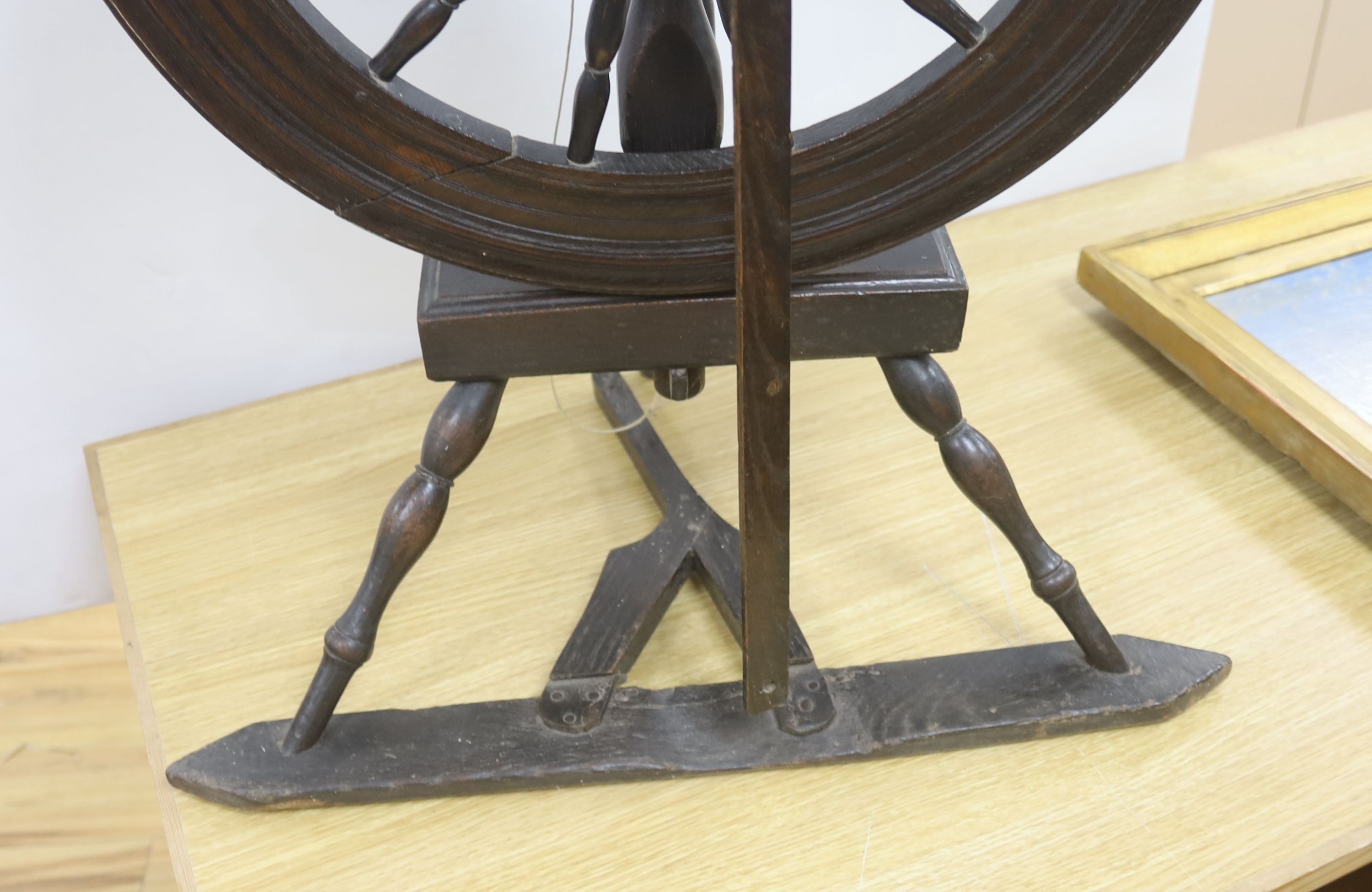 A 19th century beech and ash spinning wheel, 109 cm high